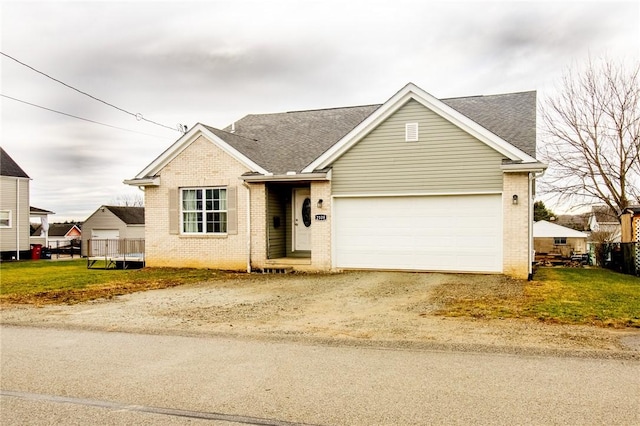 view of front facade with a front lawn and a garage