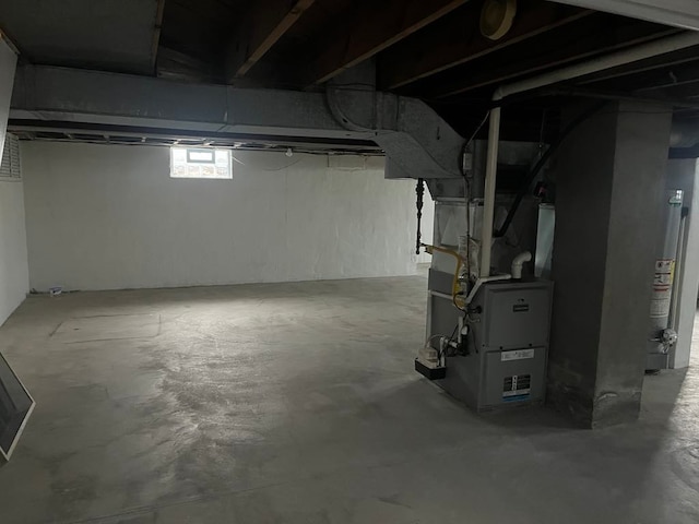 basement featuring heating unit