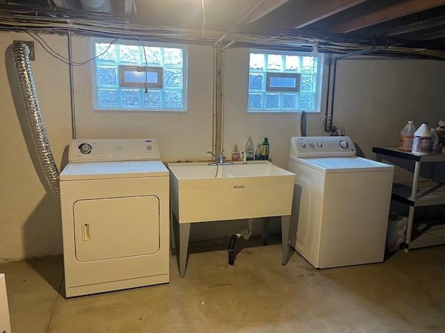 laundry room with washer and clothes dryer and sink