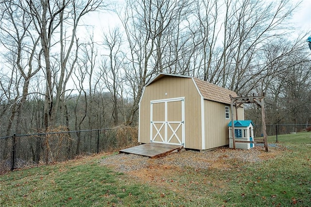 view of outdoor structure with a lawn