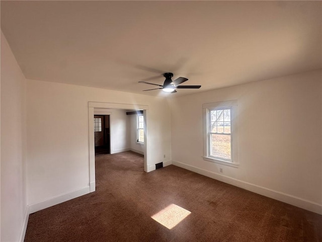 carpeted empty room with ceiling fan