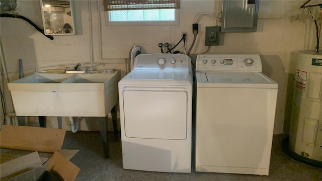 clothes washing area with electric panel, sink, gas water heater, and independent washer and dryer