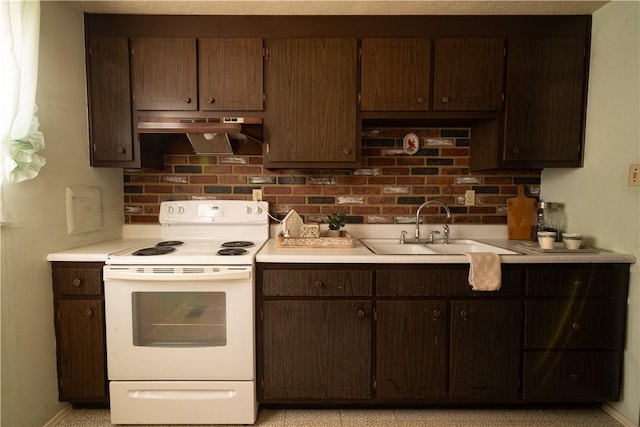 kitchen with dark brown cabinets, electric stove, and sink