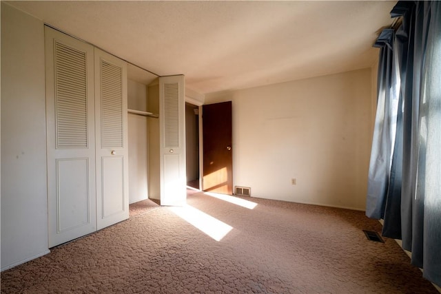 unfurnished bedroom featuring carpet flooring