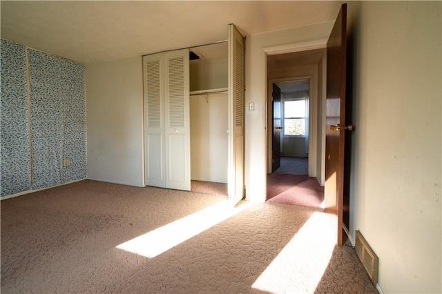 unfurnished bedroom with carpet