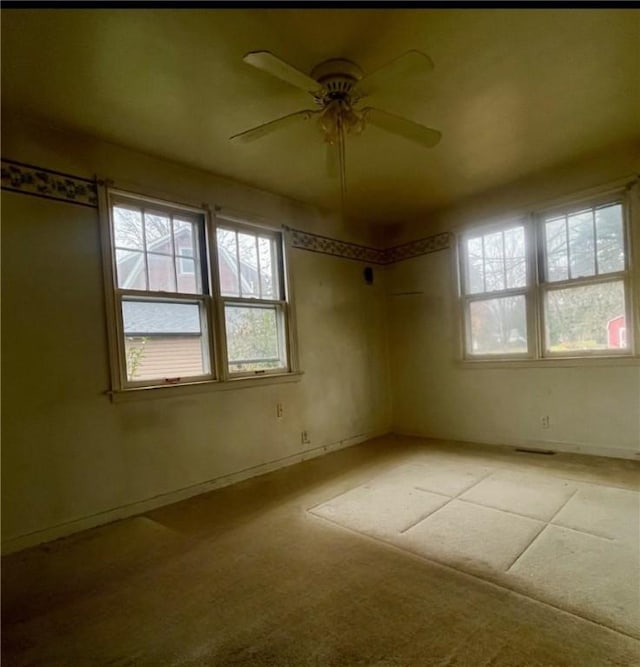 spare room featuring ceiling fan