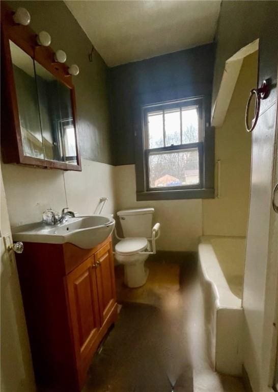 bathroom featuring vanity and toilet