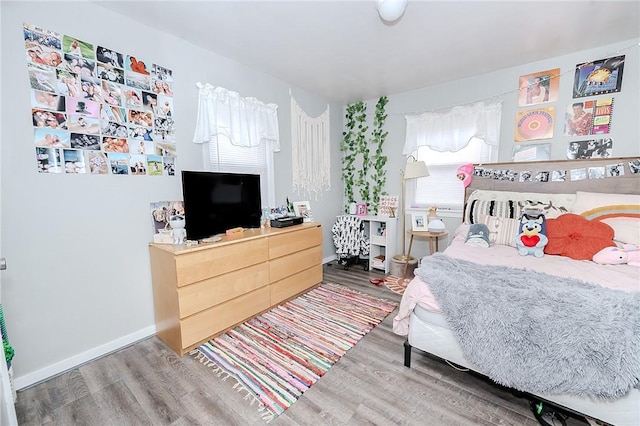 bedroom with wood-type flooring