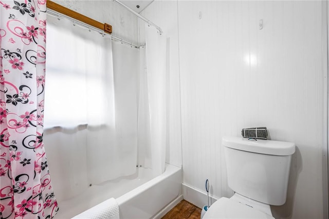 bathroom with toilet, shower / bath combo with shower curtain, and wood-type flooring