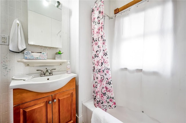 bathroom featuring vanity and shower / tub combo