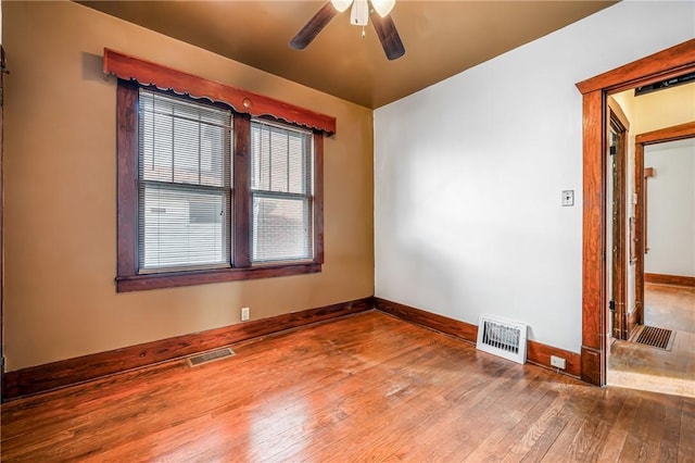 spare room with ceiling fan and hardwood / wood-style floors