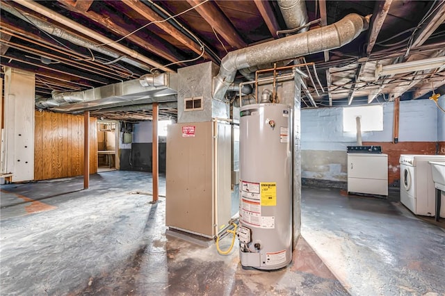 basement featuring separate washer and dryer and water heater