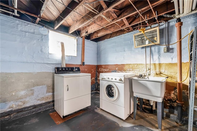 laundry area with washer and dryer and sink