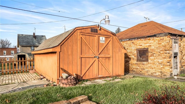 view of outbuilding with a lawn