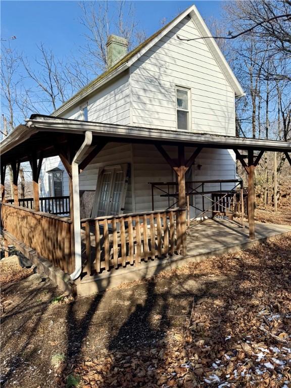 view of home's exterior featuring covered porch