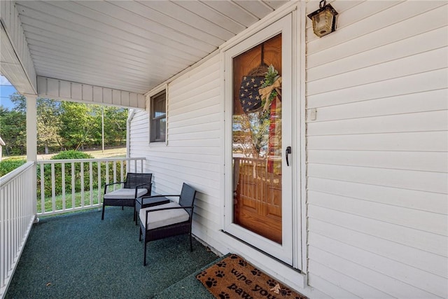 view of exterior entry featuring a porch