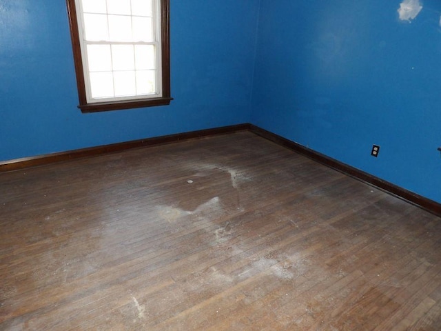 spare room with hardwood / wood-style floors