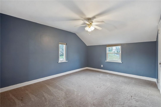 additional living space with ceiling fan, carpet, and vaulted ceiling