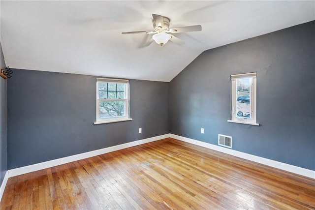 bonus room featuring light hardwood / wood-style floors, vaulted ceiling, and ceiling fan