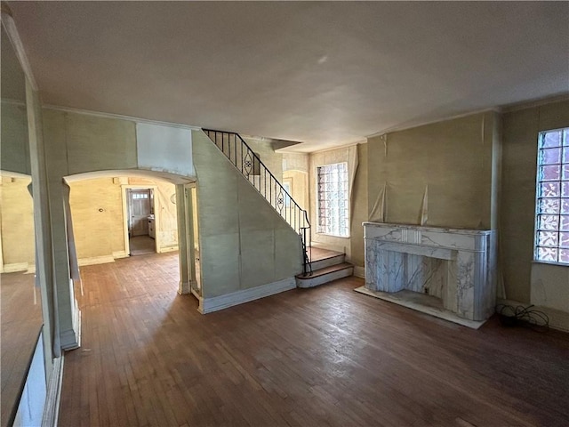 unfurnished living room featuring a fireplace and hardwood / wood-style floors