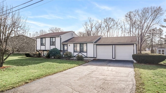 view of front of home with a front yard and a garage