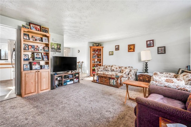 carpeted living room featuring a textured ceiling