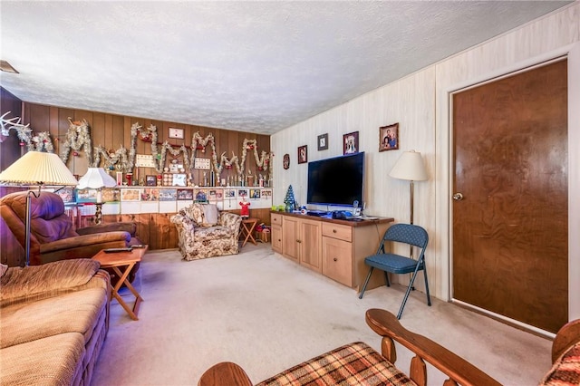 living room with light carpet and a textured ceiling