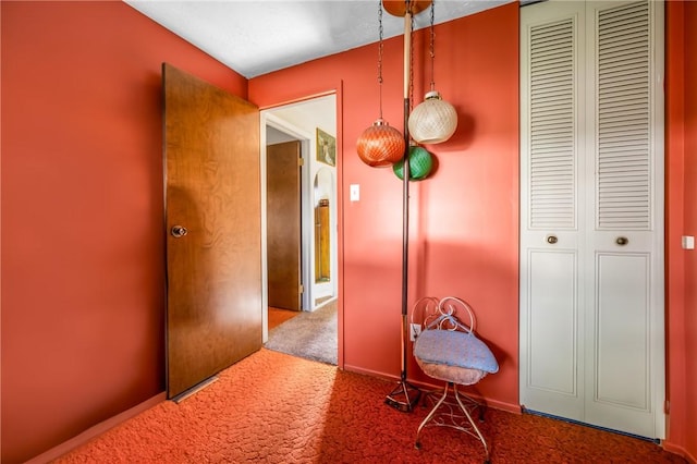 hallway with carpet flooring