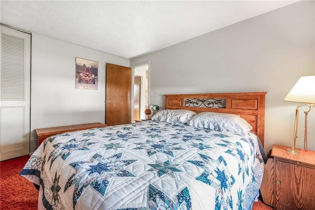 bedroom with carpet floors and a closet