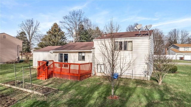 back of house with a deck and a lawn