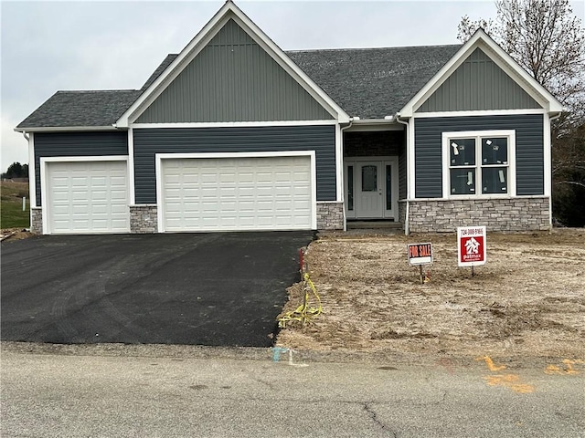 craftsman-style home with a garage