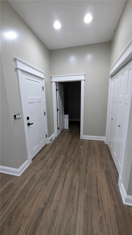 hall featuring dark wood-type flooring