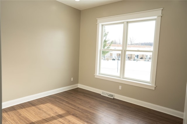 empty room with wood-type flooring