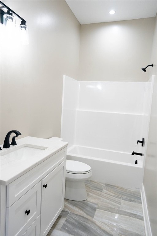 full bathroom with vanity, tub / shower combination, and toilet