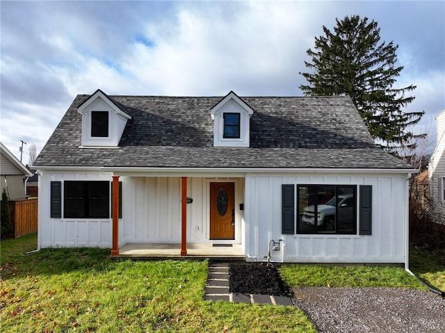 view of front facade with covered porch and a front lawn