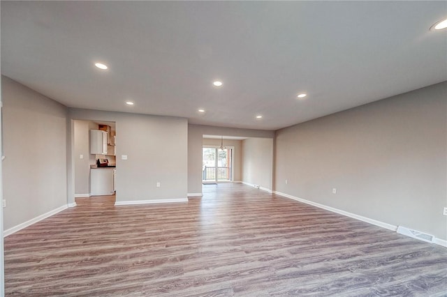 unfurnished room featuring light hardwood / wood-style floors