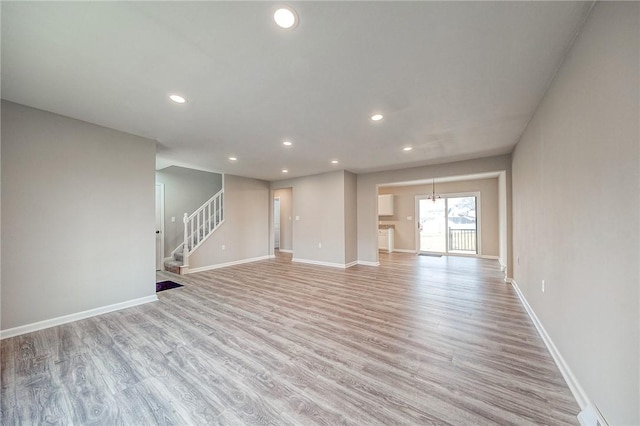 unfurnished living room featuring light hardwood / wood-style flooring