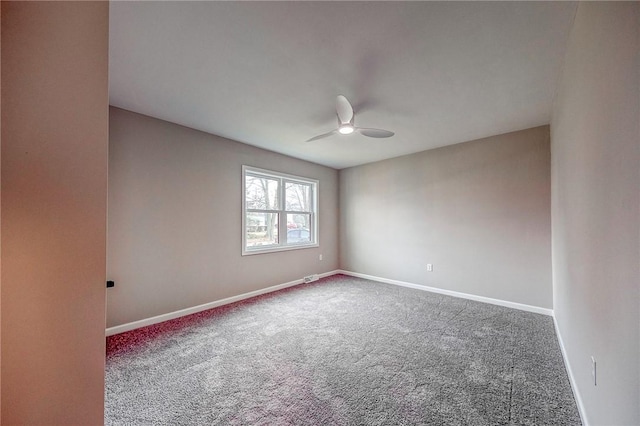 carpeted empty room featuring ceiling fan