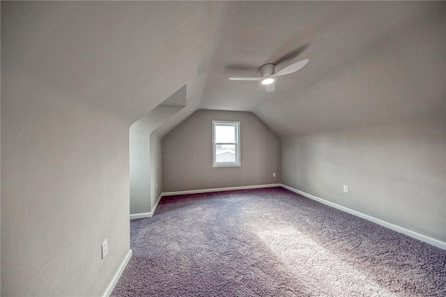 bonus room featuring ceiling fan, carpet, and vaulted ceiling