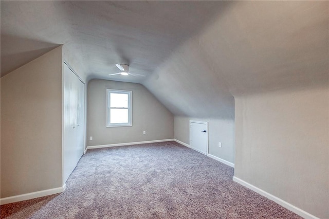 bonus room featuring carpet, vaulted ceiling, and ceiling fan