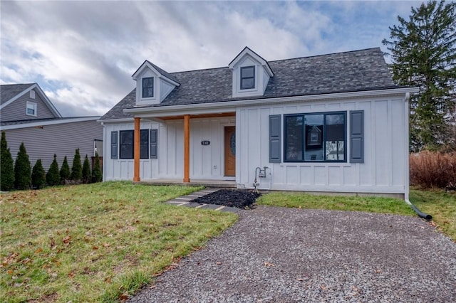 view of front of home featuring a porch and a front lawn