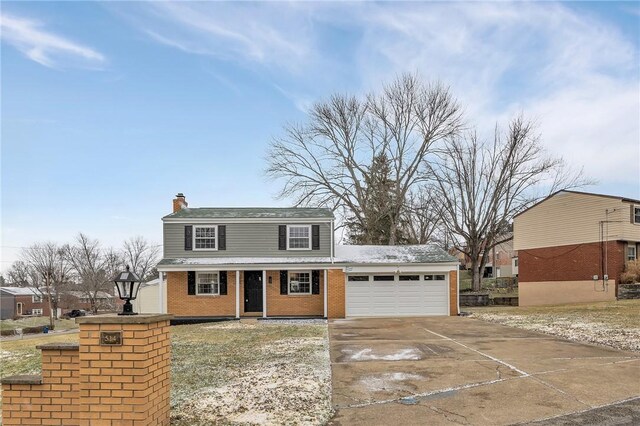 view of front of home with covered porch and a garage