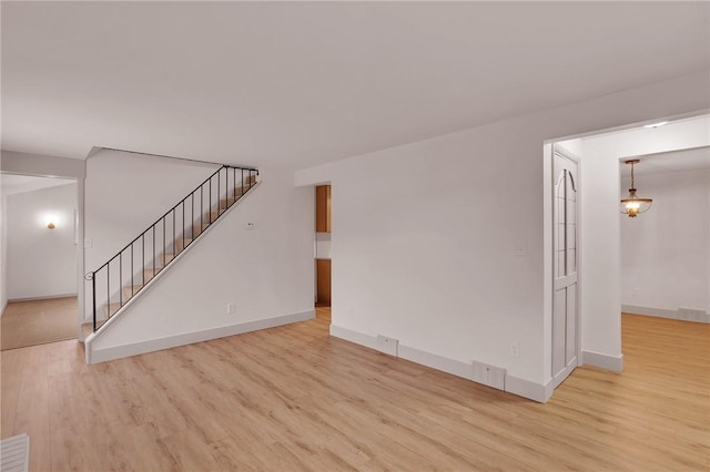 unfurnished living room featuring light hardwood / wood-style flooring