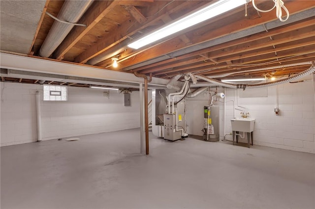 basement with sink, electric panel, heating unit, and gas water heater