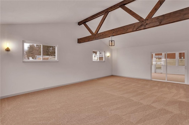 unfurnished room featuring beam ceiling, carpet floors, and high vaulted ceiling