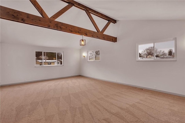 spare room featuring high vaulted ceiling, beamed ceiling, and carpet flooring