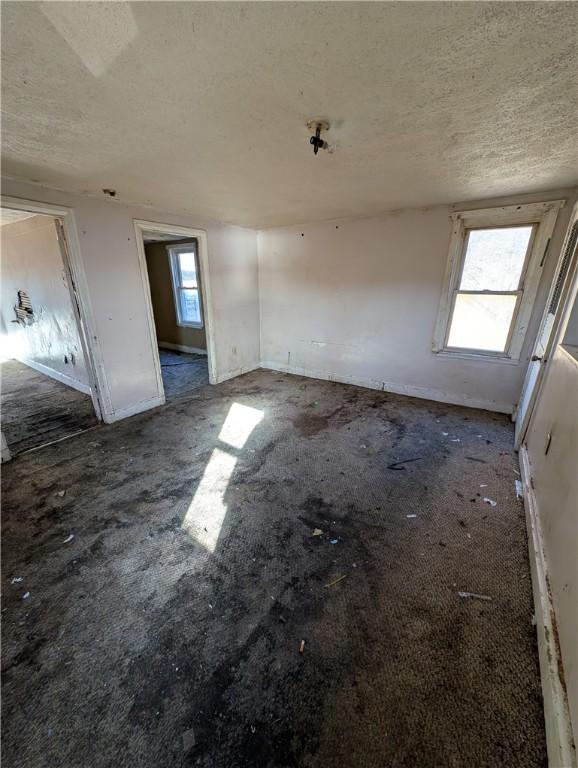 empty room with a textured ceiling