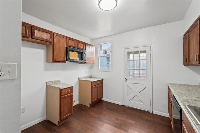 kitchen featuring black appliances, sink, and dark wood-type flooring