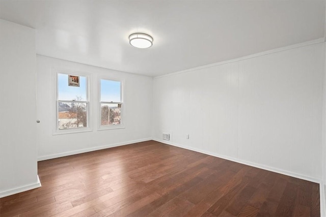 empty room featuring dark hardwood / wood-style floors