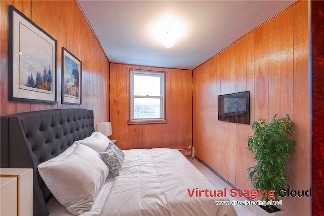 bedroom with wooden walls